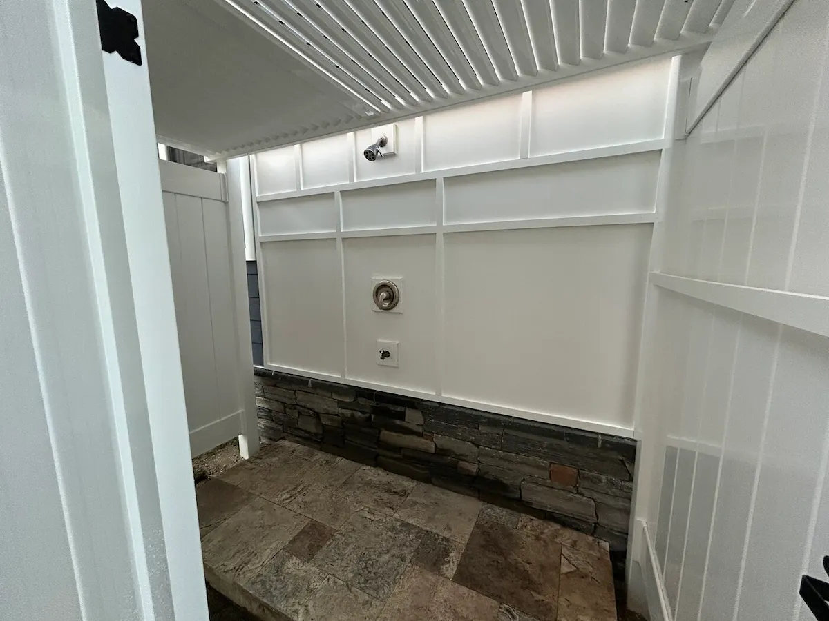 Wildwood Crest NJ outdoor shower board batten stone base travertine floor